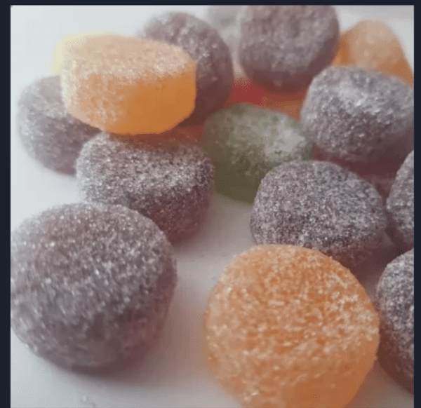 Colorful vegan fruit pastilles covered in sugar